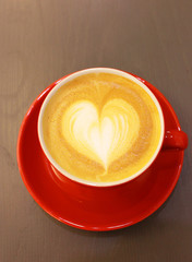 Cappuccino or latte coffee with heart shape