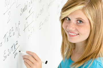 Fototapeta premium Student teenage girl write mathematics white board