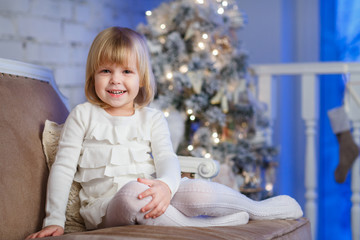 Fototapeta premium Happy girl near Christmas tree.