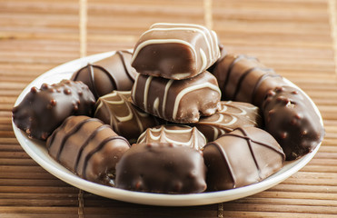 chocolate pralines on old wooden table