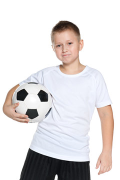 Confident boy with soccer ball