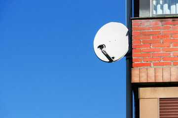 satellite antenna on house facade