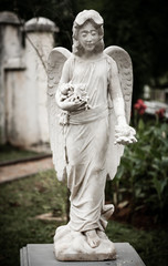 Statue of angel in old cemetery Museum Prasasti