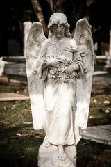 Statue of angel in old cemetery Museum Prasasti