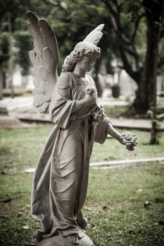 Statue of angel in old cemetery Museum Prasasti