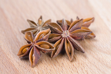 star anise on wooden surface