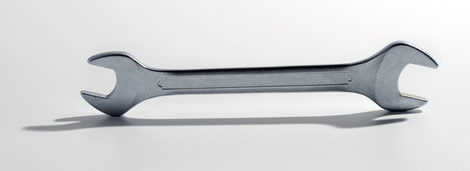 Metal spanner standing on edge