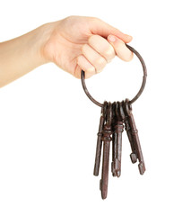Bunch of old keys in hand isolated on white