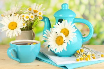Beautiful bouquet chamomiles in teapot
