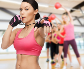 woman with whistle in gym