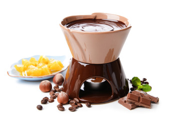 Chocolate fondue with marshmallow candies and fruits, isolated