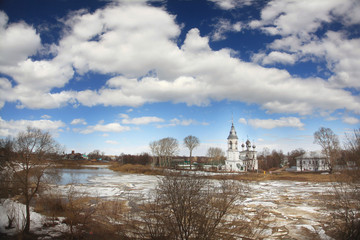 Obraz premium Ice drift on the river in Russia, the church on the shore, the i