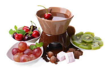 Chocolate fondue with marshmallow  and fruits, isolated on
