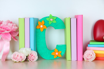 Shelf decorated with handmade knit letter