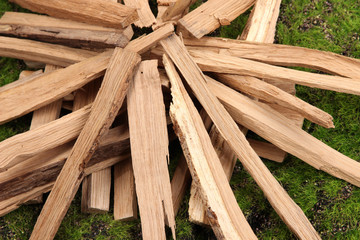 Stack of firewood on grass close up