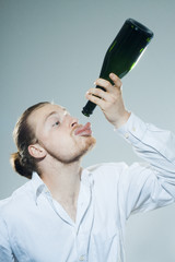 young man drinking alkohol