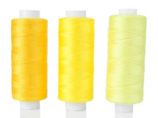 Colored spools of threads isolated on white