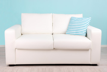 White sofa in room on blue background