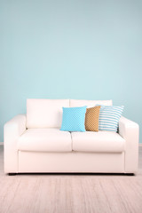 White sofa in room on blue background