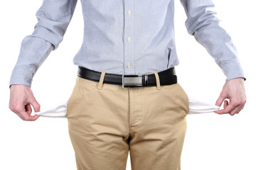 Man showing his empty pockets isolated on white