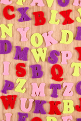 English alphabet on wooden background