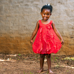 African girl showing red dress. © karelnoppe