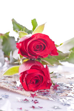 two red rose with silver star