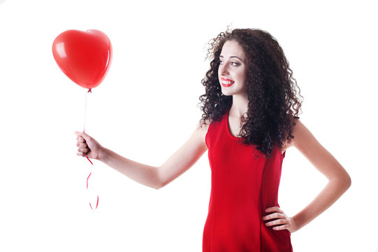 Beautiful girl holding red balloon