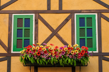 Fototapeta na wymiar Colorful building with flower decoration