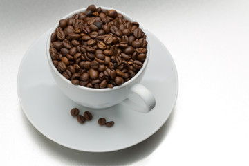 Coffee beans with cup