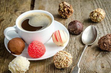 Luxury chocolate candies and cup of coffee