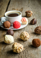 Luxury chocolate candies and cup of coffee