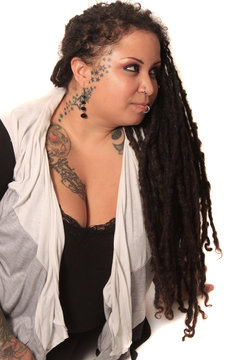 Tattooed Woman  With Piercings And Dreadlocks