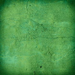 Cracked green concrete wall texture