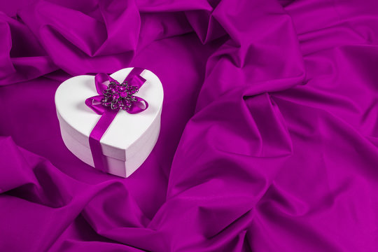love card with heart on a purple fabric