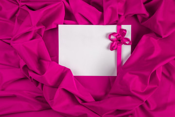 love card with ribbon on a purple fabric