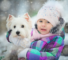 girl playing with a white dog winter snow happiness