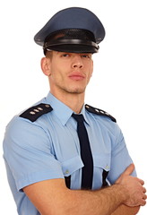 Portrait of young policeman on white background