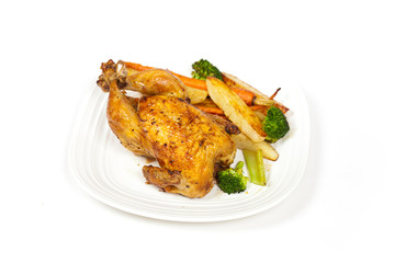 Whole roasted chicken and various vegetables