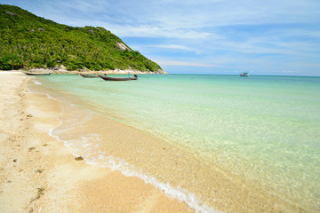 Boat floating on transparent water