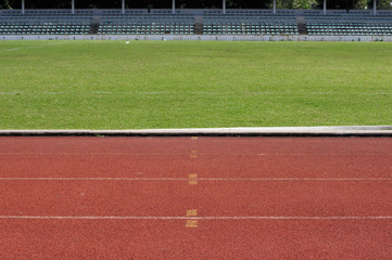 Obraz premium Orange racecourse and green yard.