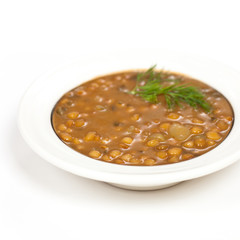 Lentil soup with vegetables in the plate