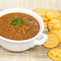 Lentil soup with saltine crackers