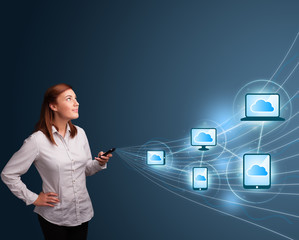 Pretty lady typing on smartphone with cloud computing