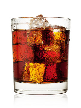 Round glass of cola with ice