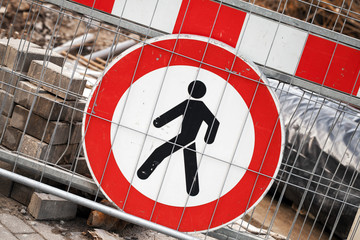 Under construction. Red and white restricted area sign