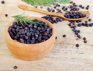 Wooden bowl with seeds of juniper