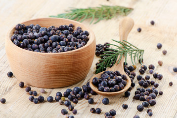 Wooden bowl with seeds of juniper