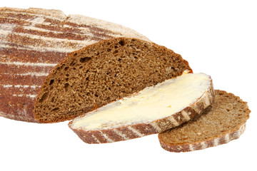 black homemade sliced bread with butter