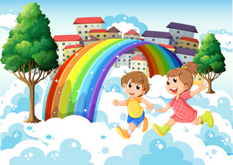 Fototapeta na wymiar Kids playing near the rainbow